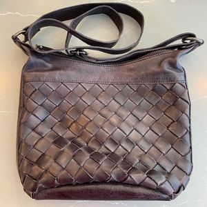 Rarely used Latico woven crossbody bag in eggplant.